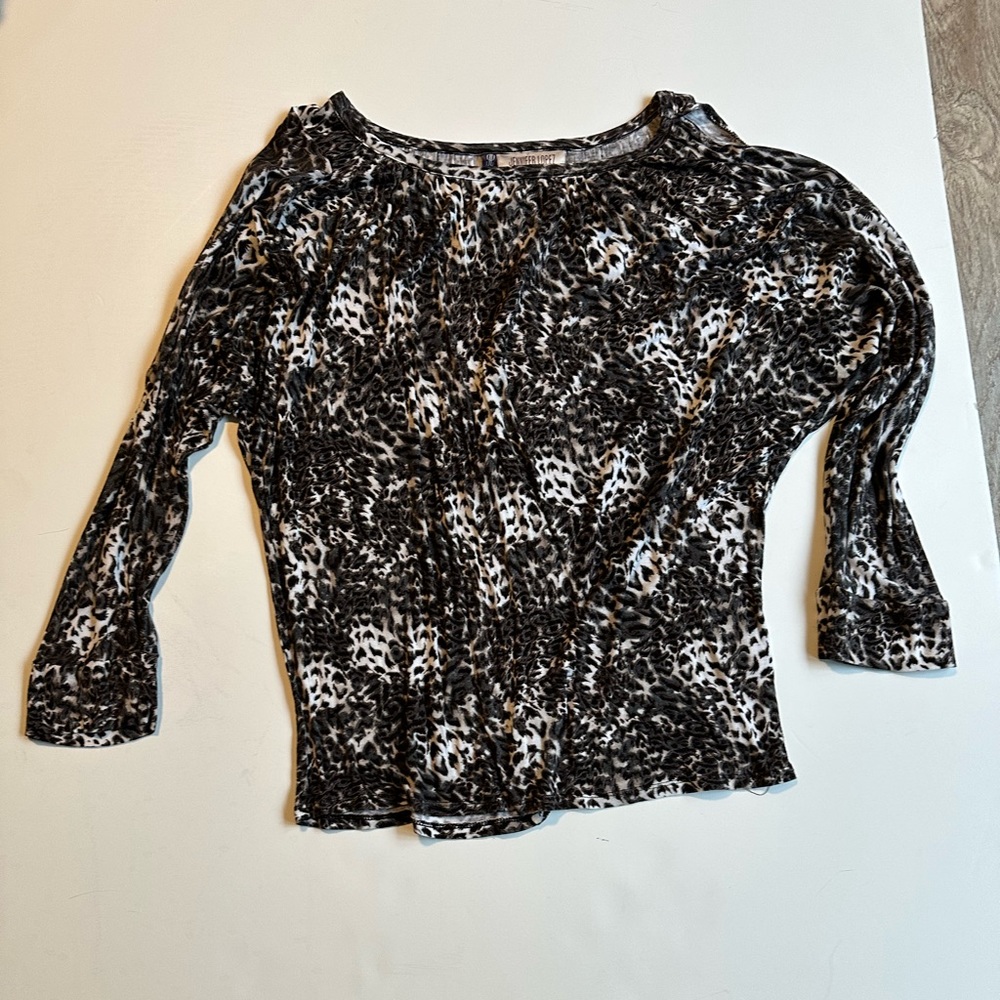 Jennifer Lopez shirt. White and gray design.